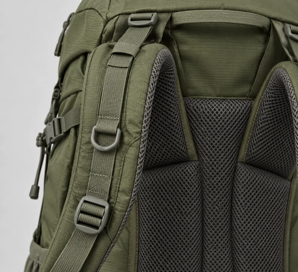 Concept close view of olive-green backpack shoulder strap webbing, upper attachment and lower adjustment buckle