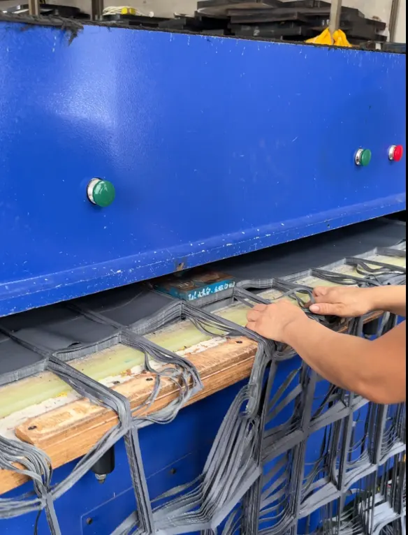 Fabric components being handled at a cutting workstation in Hongzhao's supplied factory photo