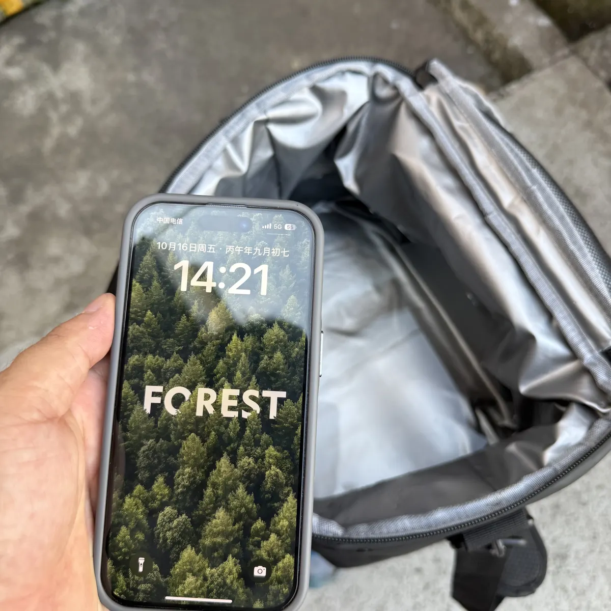 Phone displaying 14:21 beside the soft cooler near the end of the water check